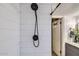 Close-up of a subway tile shower with modern black fixtures at 624 N Ashbrook Cir, Mesa, AZ 85213