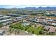 Aerial view of residential area with pool, playground, and mountain views at 6621 E Villa Rita Dr, Phoenix, AZ 85054