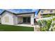 Inviting backyard with artificial turf, covered patio, and seamless indoor-outdoor flow at 6621 E Villa Rita Dr, Phoenix, AZ 85054