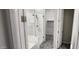 Bright bath featuring glass enclosed shower, tiled floor and updated finishes at 6621 E Villa Rita Dr, Phoenix, AZ 85054