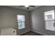 Bright bedroom features windows and a ceiling fan at 6621 E Villa Rita Dr, Phoenix, AZ 85054