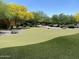 Community park featuring manicured landscaping, trees, and walking path at 6621 E Villa Rita Dr, Phoenix, AZ 85054