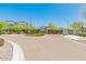 View of the gated community entrance, featuring a stylish gate and well-maintained landscaping at 6621 E Villa Rita Dr, Phoenix, AZ 85054