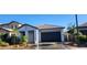 A charming home showcasing manicured landscaping, a neutral color palette, and a two-car garage at 6621 E Villa Rita Dr, Phoenix, AZ 85054