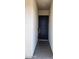 A classic black front door with elegant gold hardware and minimalist trim, set against a neutral exterior wall at 6621 E Villa Rita Dr, Phoenix, AZ 85054