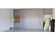 Spacious garage with ample gray cabinet storage and epoxy flooring at 6621 E Villa Rita Dr, Phoenix, AZ 85054