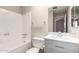 Bathroom featuring tile flooring, shower/tub, vanity, and a large mirror at 6818 N 35Th Ave # C, Phoenix, AZ 85017