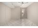 Bedroom featuring tile flooring, window, neutral paint, and a ceiling fan at 6818 N 35Th Ave # C, Phoenix, AZ 85017