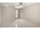 Bedroom featuring tile flooring, window, neutral paint, and a ceiling fan at 6818 N 35Th Ave # C, Phoenix, AZ 85017