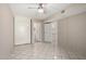 Bedroom featuring tile flooring, closet, doorways, and a ceiling fan at 6818 N 35Th Ave # C, Phoenix, AZ 85017