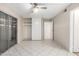 This bedroom offers tile floors, closet with sliding doors, and neutral walls at 6818 N 35Th Ave # C, Phoenix, AZ 85017