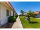 Well-maintained community featuring lush green landscaping and sidewalk lined with lovely shrubbery at 6818 N 35Th Ave # C, Phoenix, AZ 85017