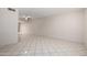 Expansive living area boasts tiled floors, neutral walls, and a ceiling fan for comfortable living at 6818 N 35Th Ave # C, Phoenix, AZ 85017