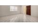Bright and spacious living area features tiled floors and a window to enjoy the views at 6818 N 35Th Ave # C, Phoenix, AZ 85017