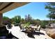 Backyard with a dining table, fire pit, outdoor grill, desert landscaping, and a desert view at 6937 E Purple Shade Cir, Scottsdale, AZ 85266