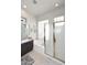Bright bathroom with a glass-enclosed shower, soaking tub, and modern fixtures at 6937 E Purple Shade Cir, Scottsdale, AZ 85266
