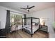 The bedroom has a canopy bed and lots of natural light from the window at 6937 E Purple Shade Cir, Scottsdale, AZ 85266