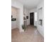 Bright and open foyer with neutral tile flooring, white walls, and a stylish decorative alcove at 6937 E Purple Shade Cir, Scottsdale, AZ 85266
