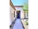 Inviting walkway to the front door, enhanced by desert landscaping with cacti and decorative rock at 6937 E Purple Shade Cir, Scottsdale, AZ 85266