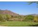 Scenic view of the golf course and mountain range, highlighting the natural beauty and recreational opportunities at 6937 E Purple Shade Cir, Scottsdale, AZ 85266