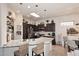 Modern kitchen featuring granite countertops, pendant lights, and stainless-steel appliances. Lots of natural light at 6937 E Purple Shade Cir, Scottsdale, AZ 85266