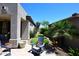 The side yard is landscaped with desert plants, grass stepping stones, and a desert view at 6937 E Purple Shade Cir, Scottsdale, AZ 85266