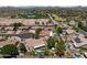 Aerial view of residential properties featuring tiled roofs, desert landscaping, and private pools at 7315 W Monte Lindo Ln, Glendale, AZ 85310