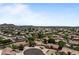 An aerial view of a residential area with single-Gathering homes featuring tiled roofs and desert landscaping at 7315 W Monte Lindo Ln, Glendale, AZ 85310