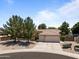A single Gathering home with xeriscape landscaping, a three-car garage, and a tile roof at 7315 W Monte Lindo Ln, Glendale, AZ 85310