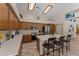 Bright kitchen features stainless steel appliances, lots of cabinets, and a kitchen island with seating at 7315 W Monte Lindo Ln, Glendale, AZ 85310