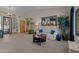 Cozy living room with a round table, neutral tones, and ample natural light at 7315 W Monte Lindo Ln, Glendale, AZ 85310