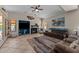 Inviting living room with a fireplace, comfortable seating, and a colorful area rug at 7315 W Monte Lindo Ln, Glendale, AZ 85310