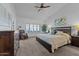 Serene main bedroom with neutral tones, large windows, comfortable bedding, and ample natural light at 7315 W Monte Lindo Ln, Glendale, AZ 85310