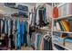 A walk-in closet with multiple shelves and rods offering ample storage for an organized wardrobe at 7315 W Monte Lindo Ln, Glendale, AZ 85310