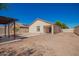 Large backyard featuring a pergola-covered patio with ample space for entertainment and potential for landscaping at 7324 S 254Th Dr, Buckeye, AZ 85326
