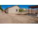 A xeriscaped backyard with a pergola patio area, offering a low-maintenance outdoor space for relaxation at 7324 S 254Th Dr, Buckeye, AZ 85326
