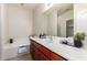 Bathroom featuring a soaking tub and expansive mirror over the vanity at 7324 S 254Th Dr, Buckeye, AZ 85326
