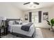 Comfortable bedroom with a ceiling fan, carpet, and natural light at 7324 S 254Th Dr, Buckeye, AZ 85326