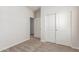 Bedroom with carpet flooring and access to the hall, closet, and bathroom at 7324 S 254Th Dr, Buckeye, AZ 85326