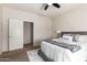 Bedroom featuring carpet flooring, ceiling fan and closet for ample storage at 7324 S 254Th Dr, Buckeye, AZ 85326
