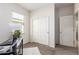 Well-lit bedroom with ample closet space, neutral carpeting, and a double door closet at 7324 S 254Th Dr, Buckeye, AZ 85326