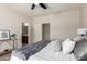 This bedroom includes views to the bathroom and dual closets at 7324 S 254Th Dr, Buckeye, AZ 85326