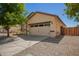 The home has a charming two-car garage and a well maintained low-maintenance desert-style landscape at 7324 S 254Th Dr, Buckeye, AZ 85326