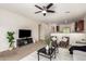 The living room showcases neutral carpeting, stylish decor, and an open-concept layout at 7324 S 254Th Dr, Buckeye, AZ 85326