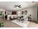 An open-concept living room with a ceiling fan and view of the kitchen at 7324 S 254Th Dr, Buckeye, AZ 85326