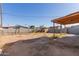 Spacious backyard featuring a mix of dirt and grass, enclosed by fences at 7619 W Clarendon Ave, Phoenix, AZ 85033