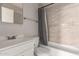 A clean bathroom is equipped with a single sink and a shower-tub combination at 7619 W Clarendon Ave, Phoenix, AZ 85033