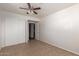 A functional bedroom provides ample storage with a closet with sliding doors and ceiling fan at 7619 W Clarendon Ave, Phoenix, AZ 85033