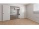 This room has tile floors and a view through open doors to a room with wood-look floors at 7619 W Clarendon Ave, Phoenix, AZ 85033