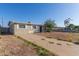 Well-maintained single-story home with a concrete driveway and minimal landscaping at 7619 W Clarendon Ave, Phoenix, AZ 85033